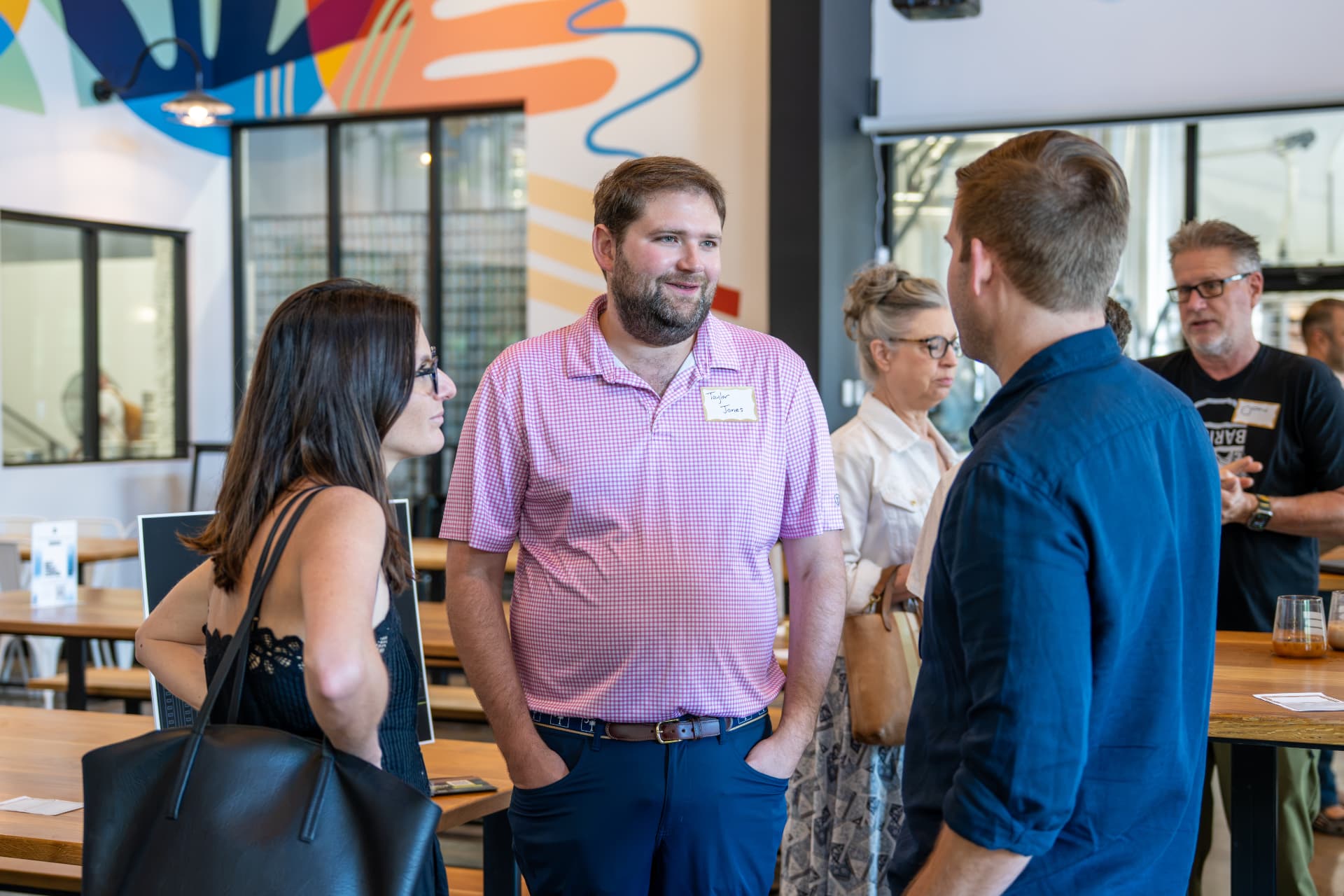 Taylor Jones talking with attendees at an ATX Marketing Innovators power breakfast